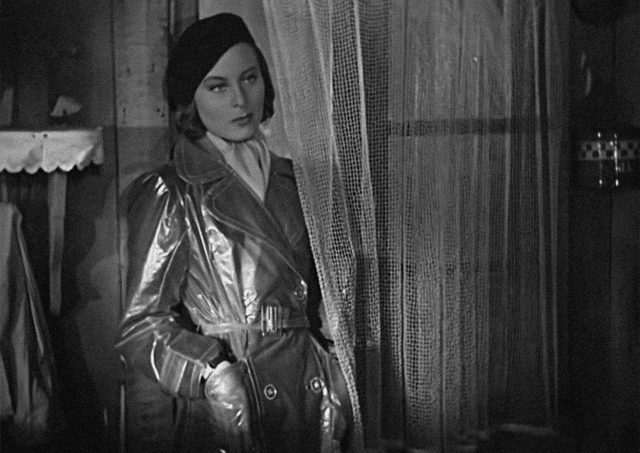 Мишель Морган Нелли рөлінде, Le Quai des Brumes, 1938